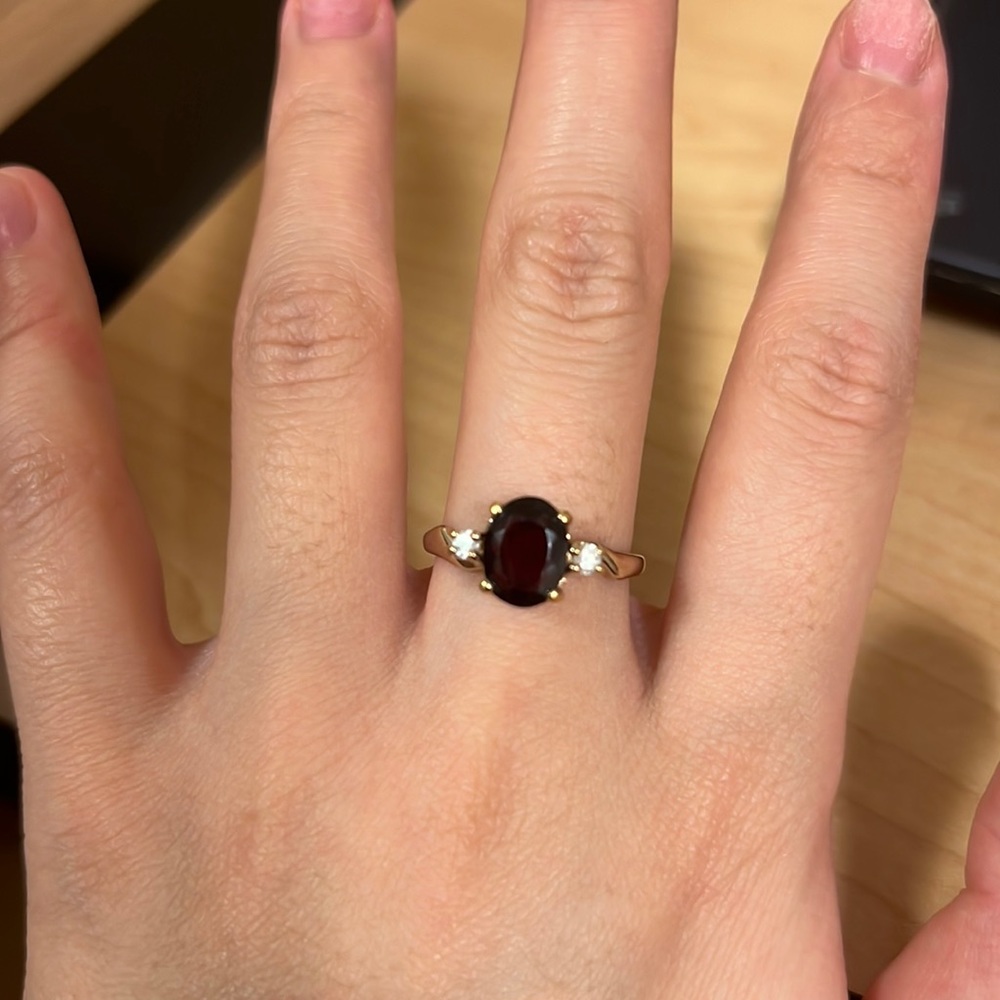 Vintage ring with one big red stone and two small stones